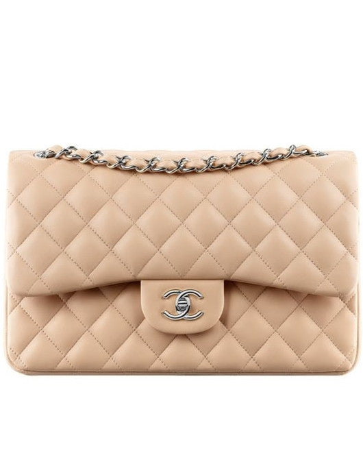 Votre Luxe - Chanel Nude Jumbo Classic Flap Bag ($8550)​​​​​​​​ ​​​​​​​​  This elegant Chanel jumbo bag is in nude caviar leather with gold-tone  metal hardware. In excellent 